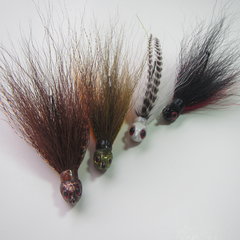 Poison Tail jigs dressed in bucktail, flash materials and grizzly hackle